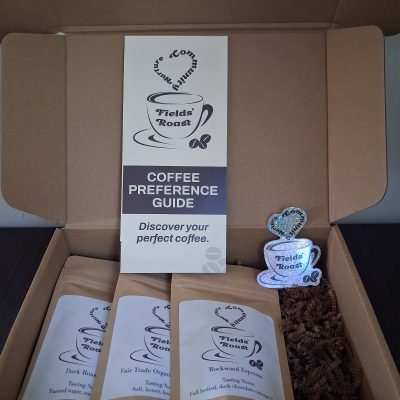 example coffee discovery kit, includes three two oz coffee samples with a pamphlet and sticker